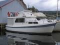 Cuddles 30 flybridge cruiser.